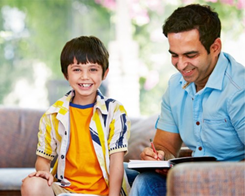 A Man And Boy Smiling