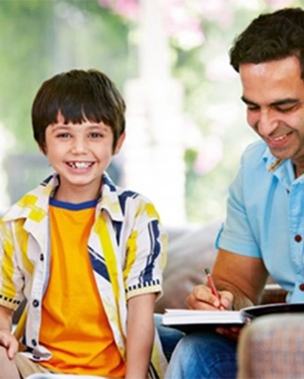 A Man And Boy Smiling